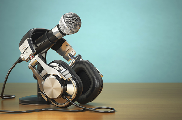 Microphone and headphones. Audio recording or radio commentator